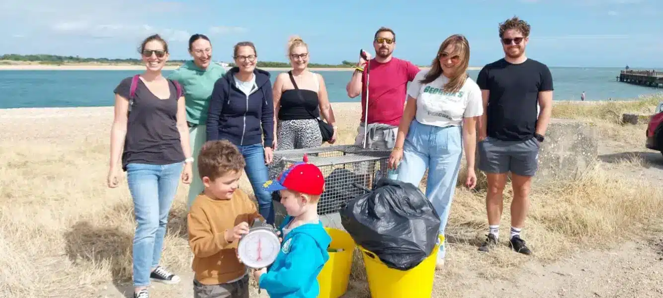 Team participating in a beach clean activity