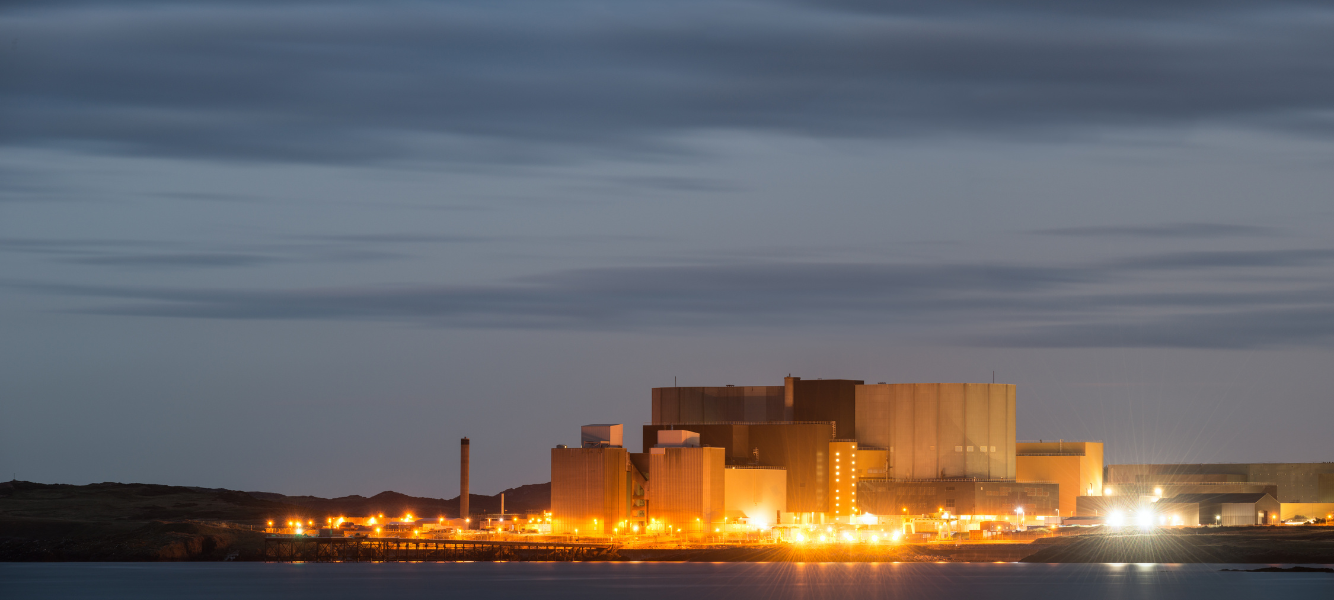 A panoramic view of Wylfa nuclear power station on Anglesey in North Wales at twilight.